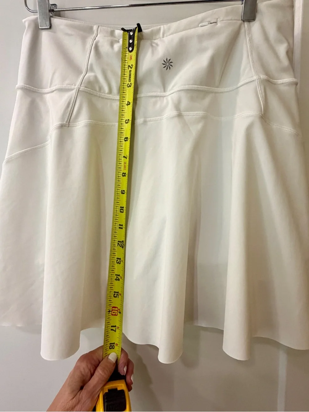 Athleta White Mini Skirt with Slight Flare, pockets on each side.
